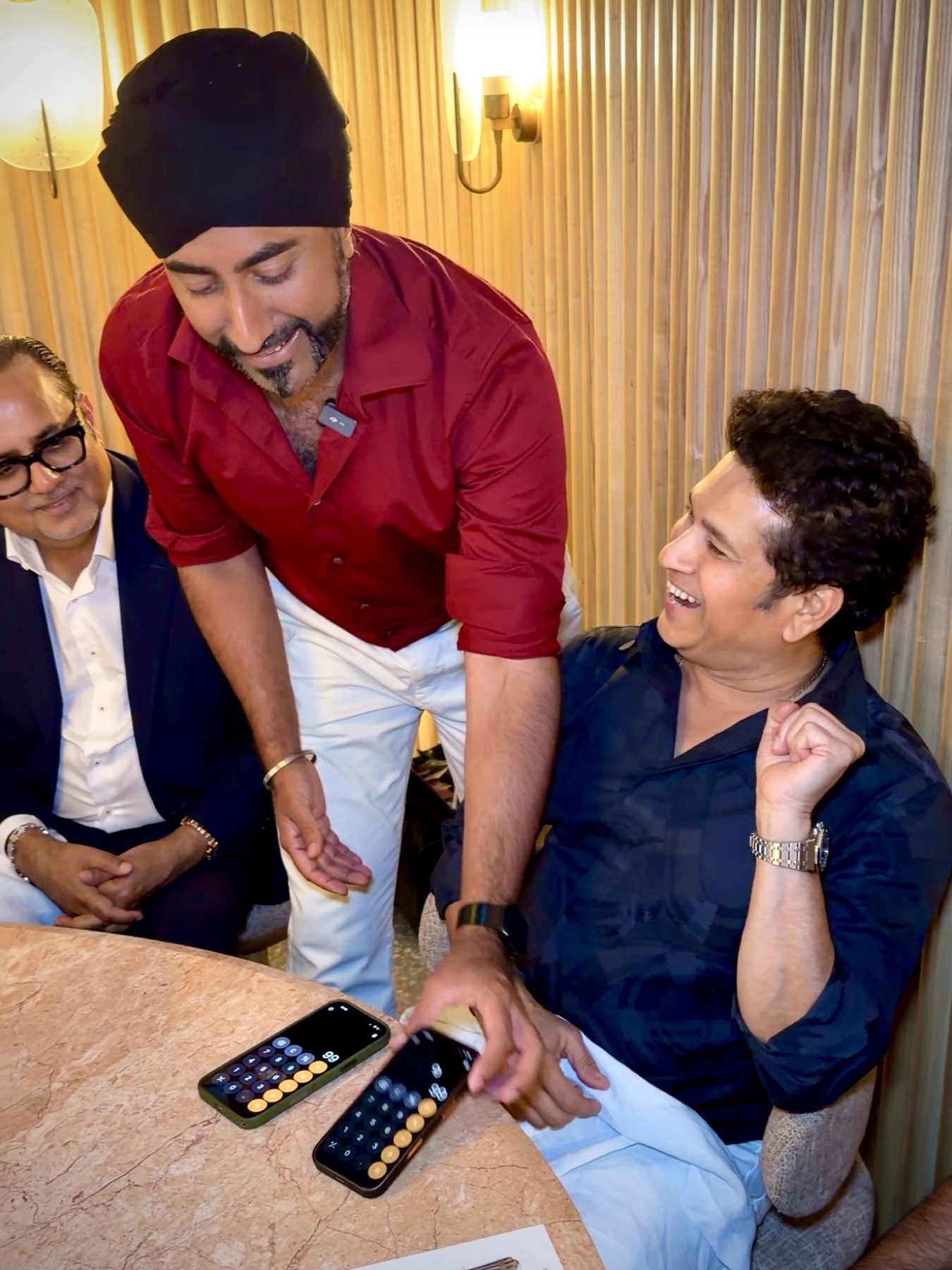 Magic Singh sharing a private magic moment with Sachin Tendulkar