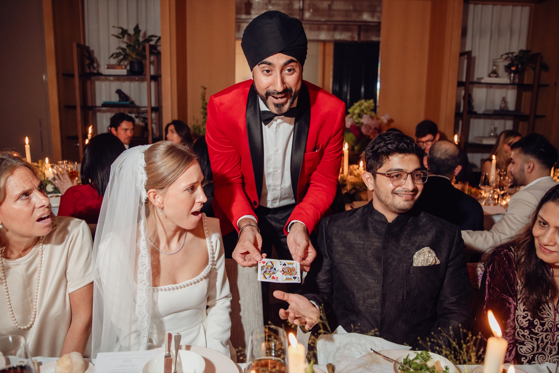 Magic Singh astonishing guests with close-up card magic